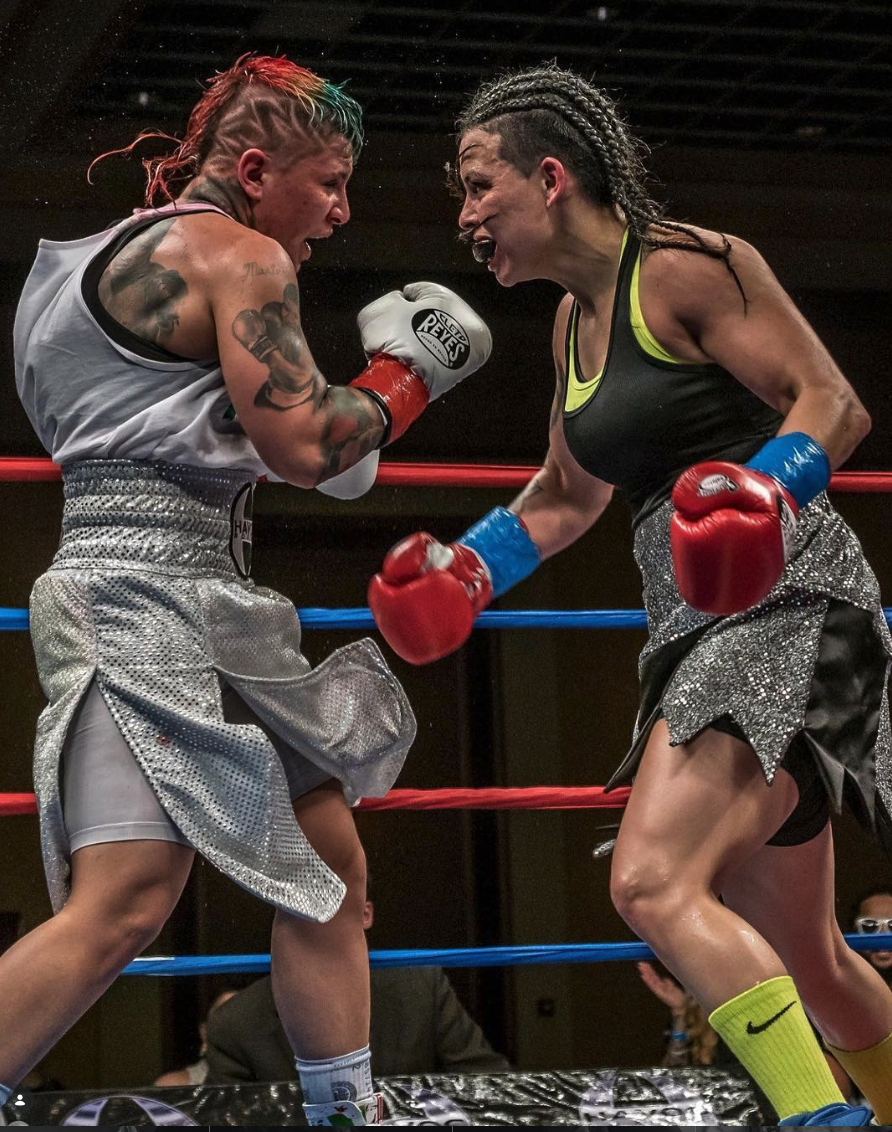 Two boxers mid-fight in the ring, Drew Pion Photography